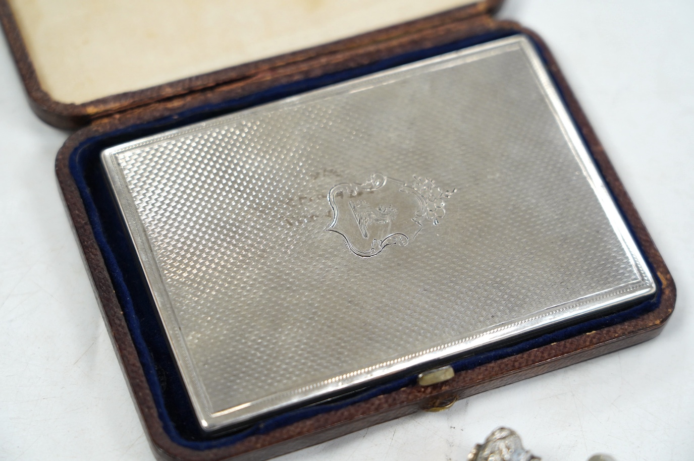 A Victorian silver mounted card purse, by Frederick Marson, Birmingham, 1859, 97mm, in a fitted case, together with a white metal vinaigrette and a white metal mounted cut glass double ended scent bottle, one end with a